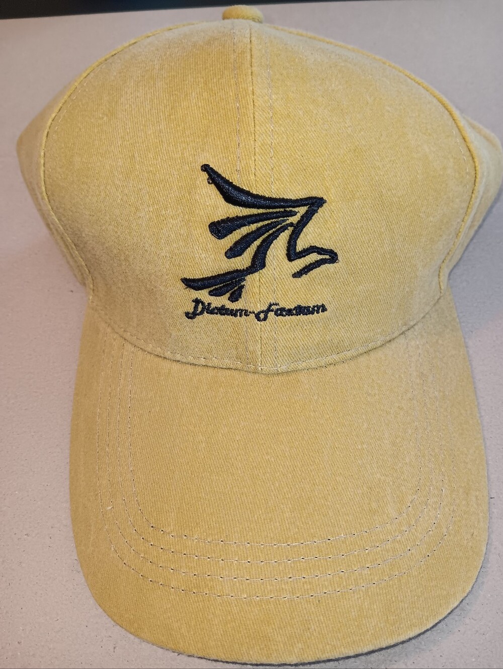 Tan Baseball Cap with Black Embroidered Logo. Adjustable. New